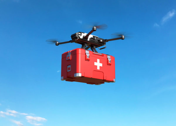 Drone flying with a first aid kit in the sky